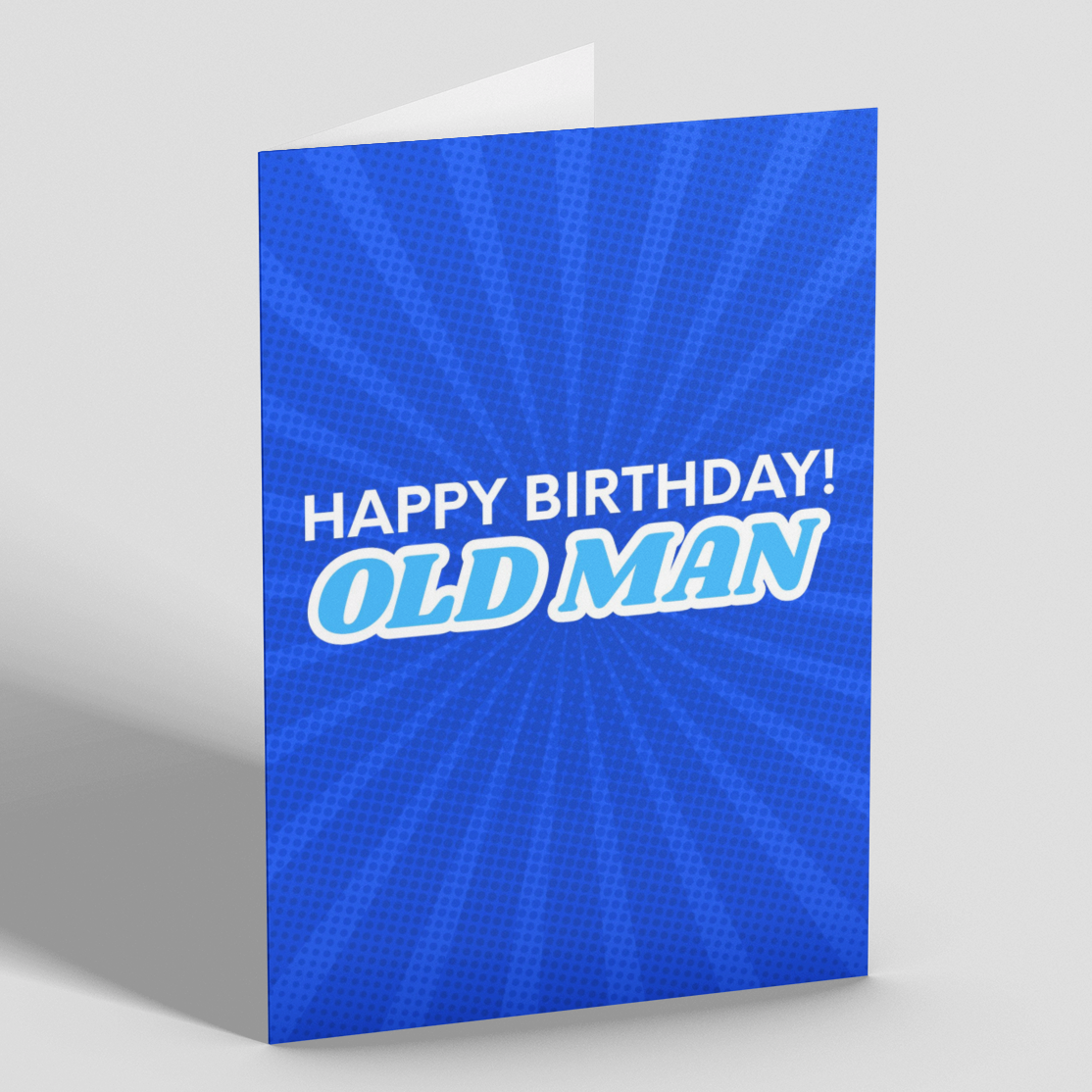A blue greeting card standing upright on a light gray background. The card has a radiating sunburst pattern and the text 'HAPPY BIRTHDAY! OLD MAN' in white and light blue lettering.