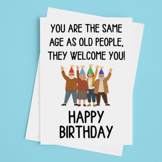 Birthday card with humorous text and illustration of people on a blue background