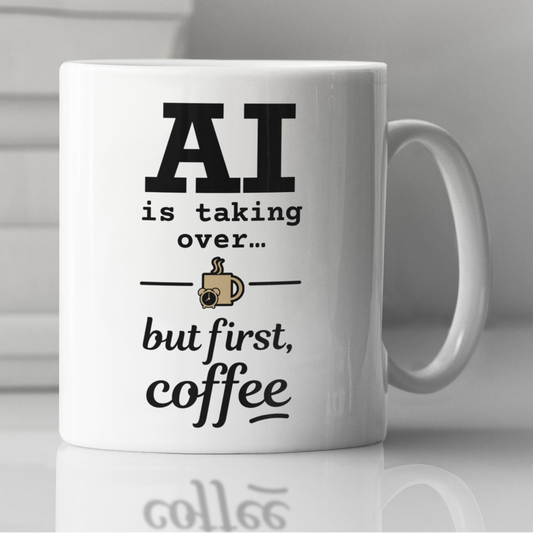 Mug with 'AI is taking over... but first, coffee' on a reflective surface.