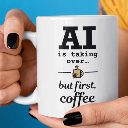Person holding a mug with text 'AI is taking over... but first, coffee' against a blue background