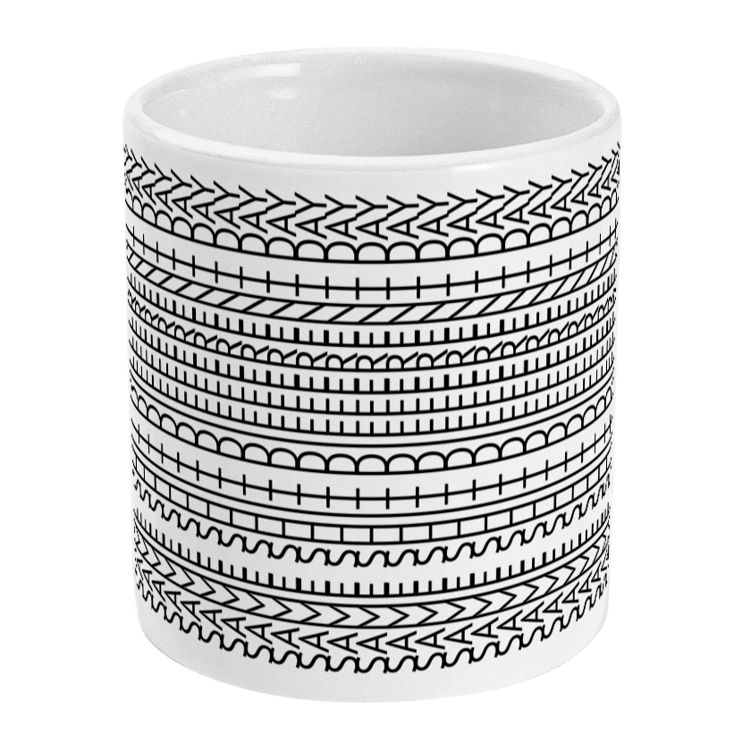 White mug with black geometric pattern on a white background
