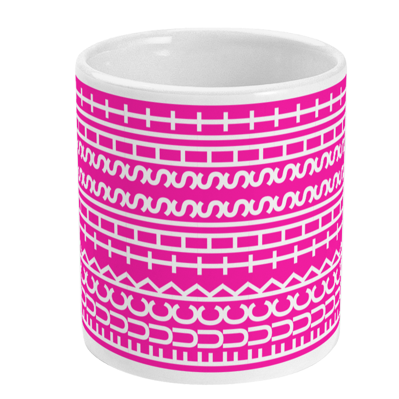 White mug with pink and white geometric pattern on a white background