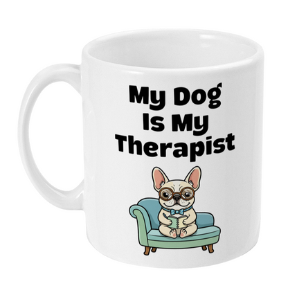 White mug with a cartoon dog on a couch and text 'My Dog Is My Therapist' on a white background