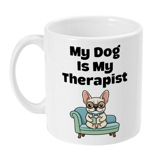 White mug with a cartoon dog on a couch and text 'My Dog Is My Therapist' on a white background