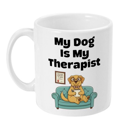 White mug with a dog sitting on a couch and text 'My Dog Is My Therapist' on a white background