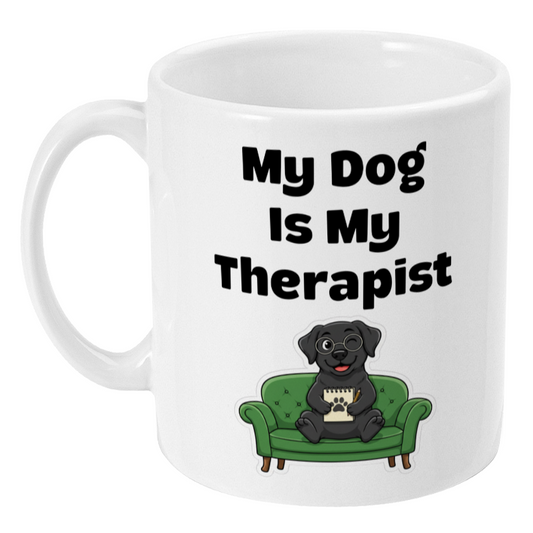 White mug with a black dog on a green couch and text 'My Dog Is My Therapist' on a white background