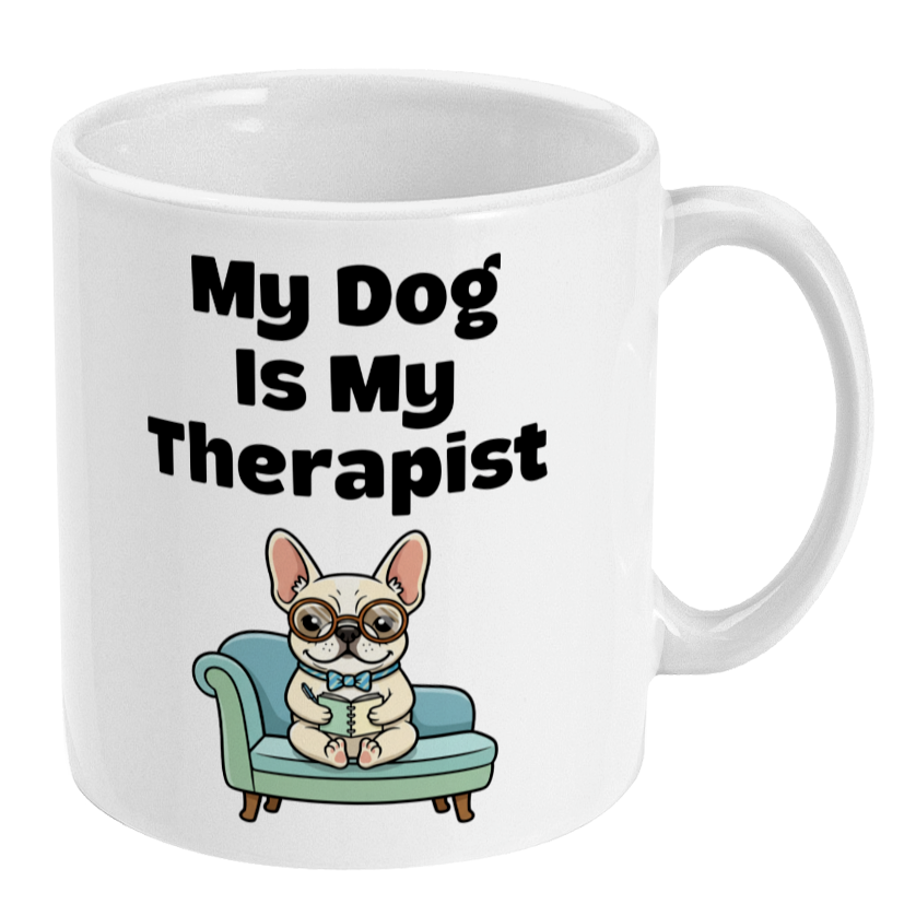 White mug with a cartoon dog on a couch and text 'My Dog Is My Therapist' on a white background