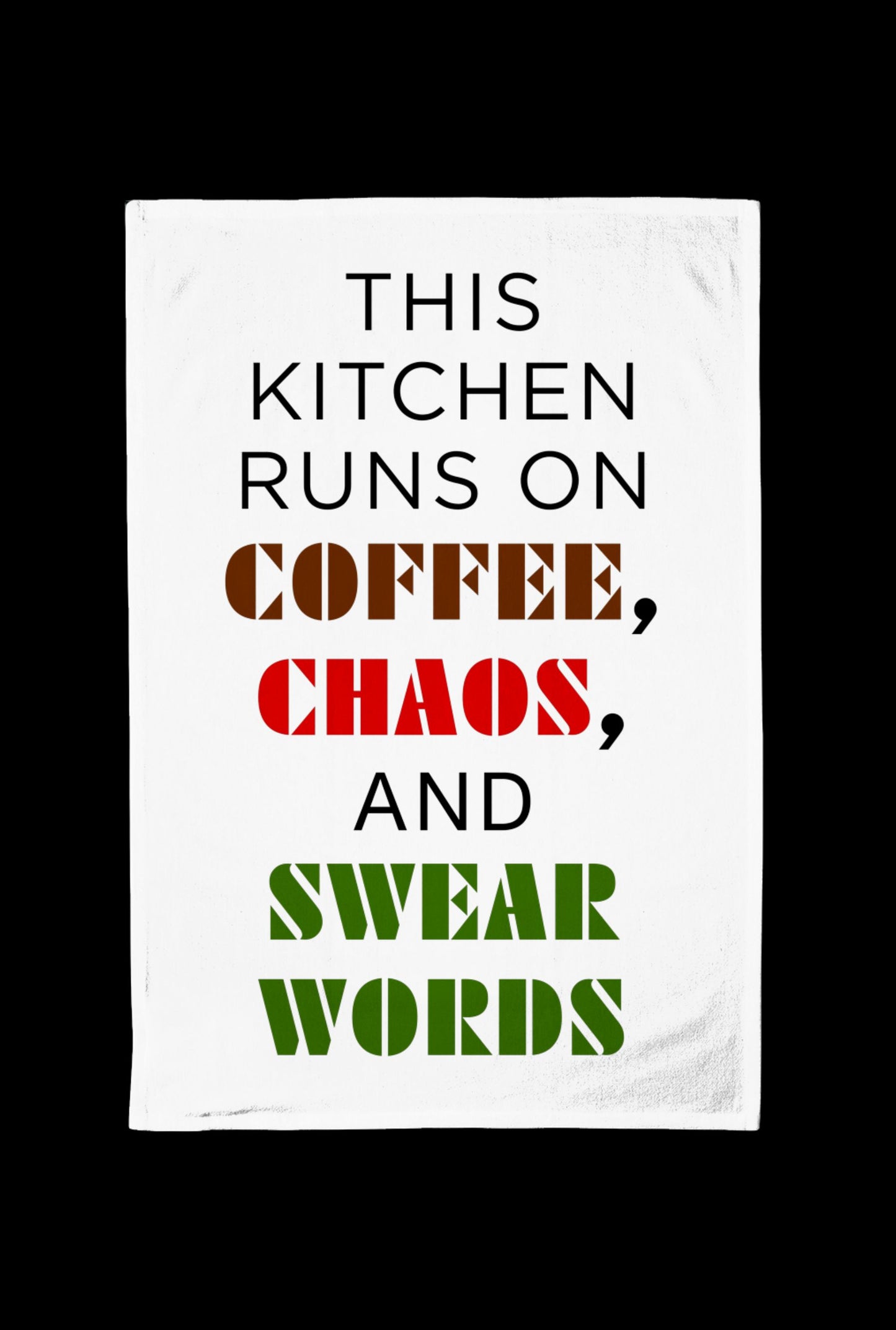 White Tea towel with text 'This kitchen runs on coffee, chaos, and swear words' on a black background
