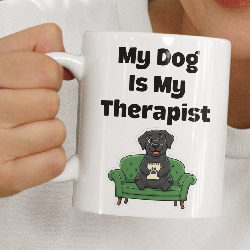 Person holding a mug with 'My Dog is My Therapist' text and dog illustration.