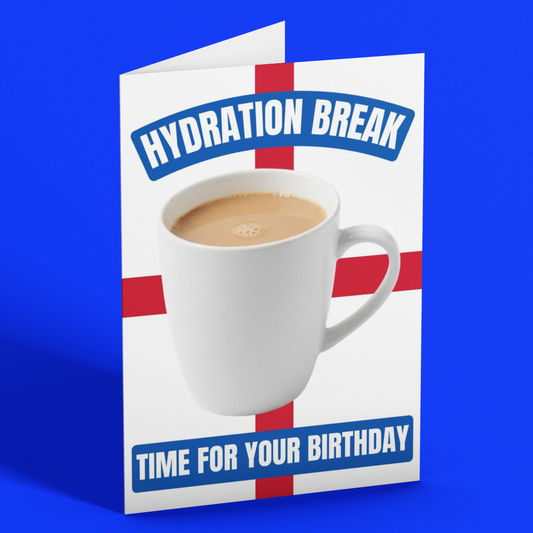 A folded greeting card standing upright on a bright blue background. The card features a white mug of coffee on a red cross design, with the text 'HYDRATION BREAK' at the top and 'TIME FOR YOUR BIRTHDAY' at the bottom.