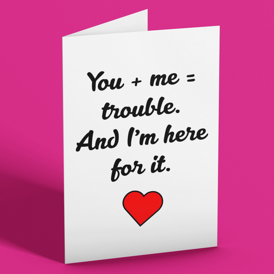 Greeting card with text 'You + me = trouble. And I'm here for it.' and a red heart on a pink background
