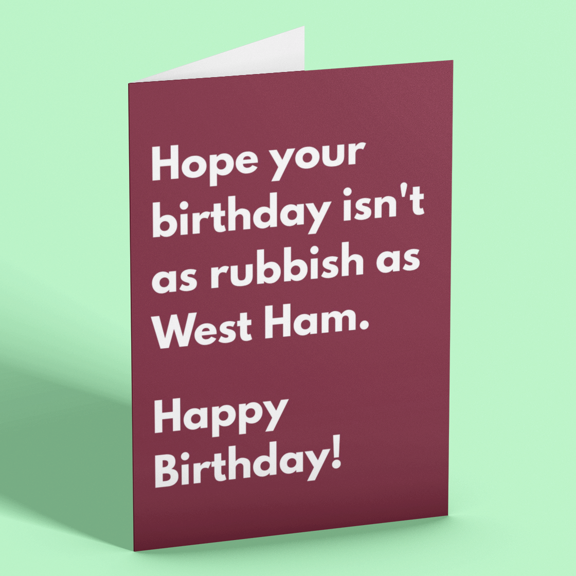 Birthday card with humorous text on a green background