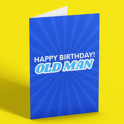 A blue greeting card standing upright on a bright yellow background. The card has a blue sunburst pattern and reads 'HAPPY BIRTHDAY! OLD MAN' in white and light blue text.