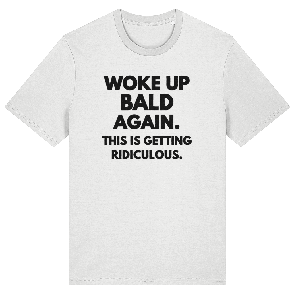White t-shirt with black text 'Woke up bald again. This is getting ridiculous.' on a white background