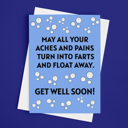 A light blue greeting card with bold black text reading 'MAY ALL YOUR ACHES AND PAINS TURN INTO FARTS AND FLOAT AWAY. GET WELL SOON!' with white bubble graphics, shown with a white envelope on a dark blue background.