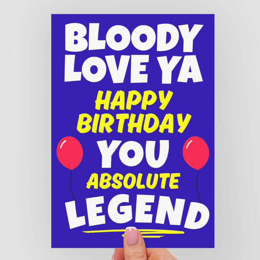 Hand holding a birthday card with colorful text on a white background