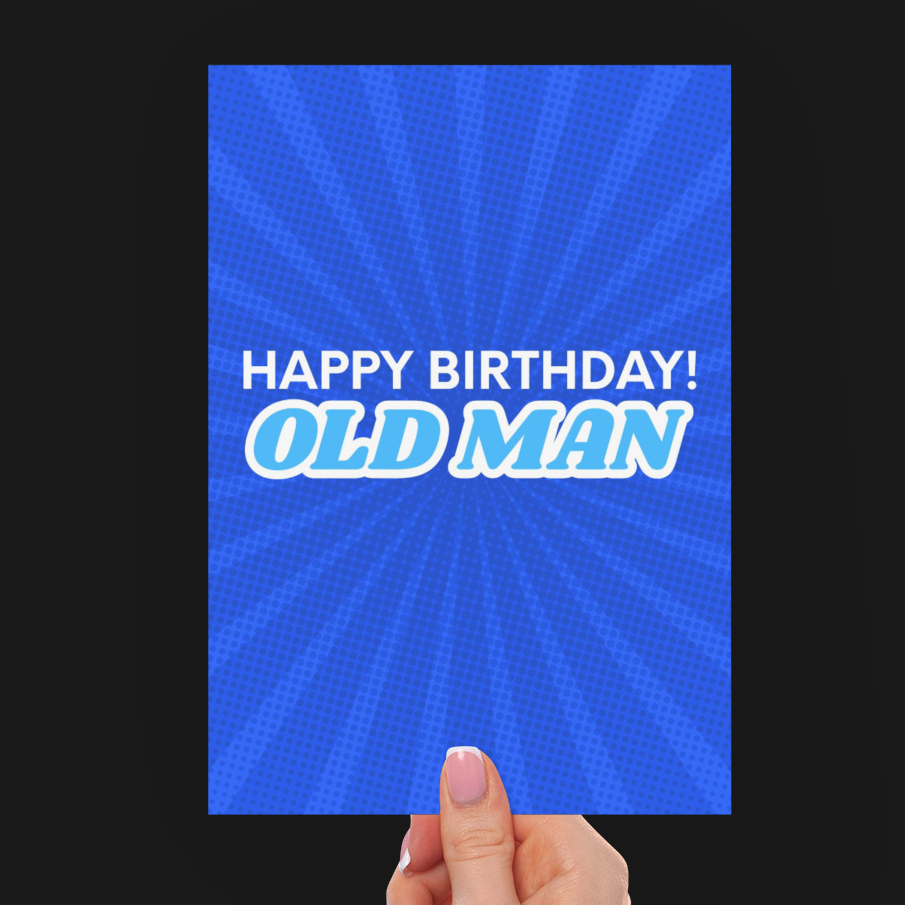 A hand holding a blue birthday card with the text 'HAPPY BIRTHDAY! OLD MAN' in white and light blue, set against a solid black background.
