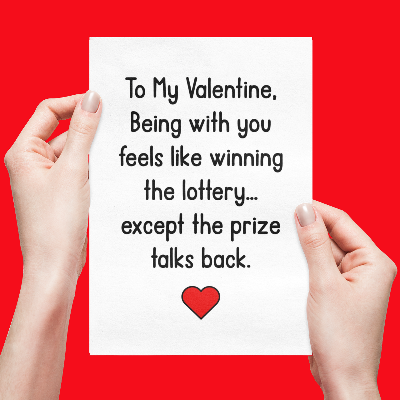 Hands holding a Valentine's Day card with humorous message on a red background